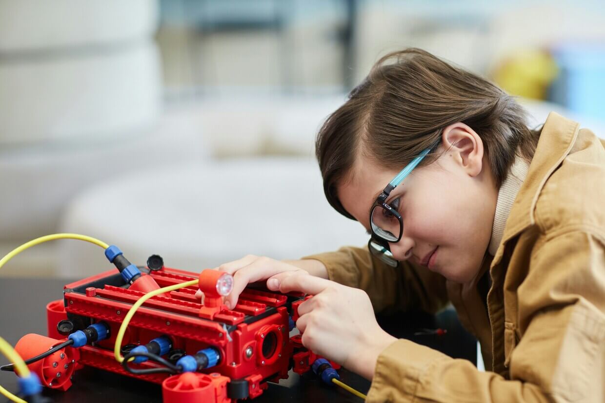 Child building a robot
