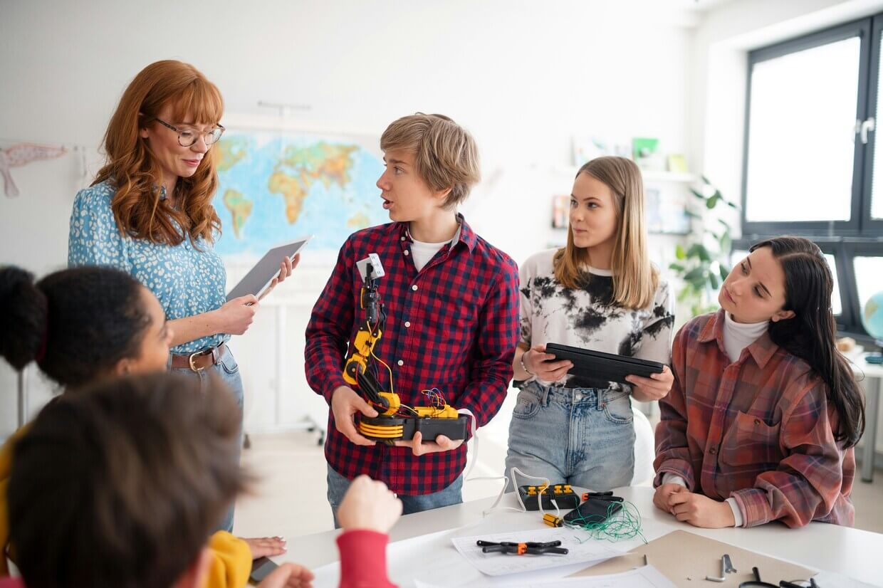 Children learning about robotics in a NextGen Education classroom